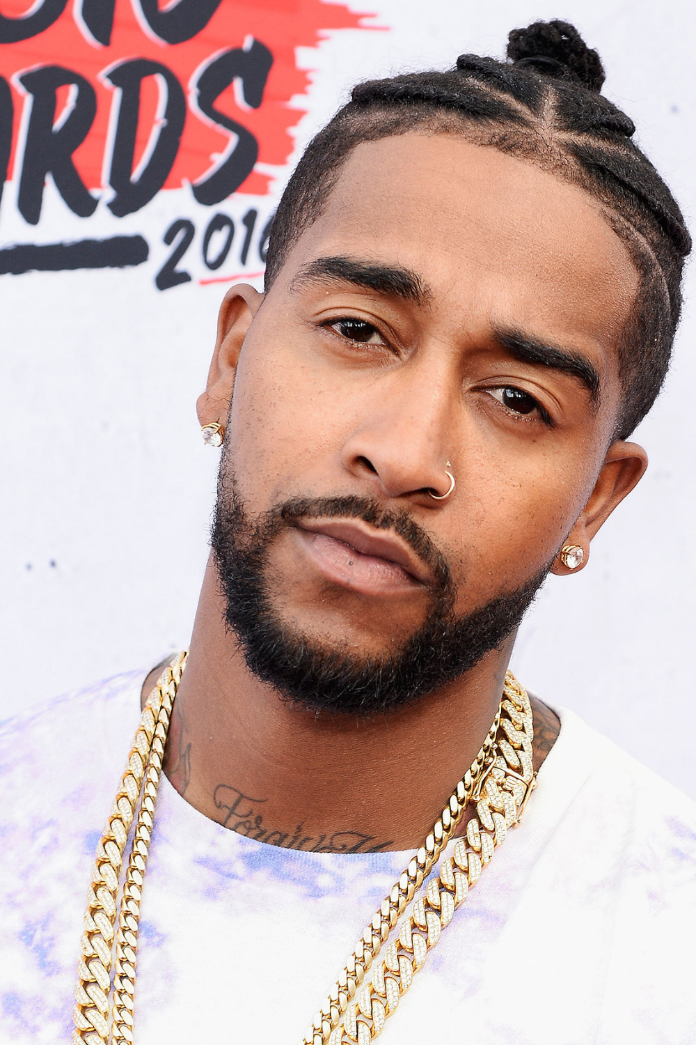 omarion braids in a topknot