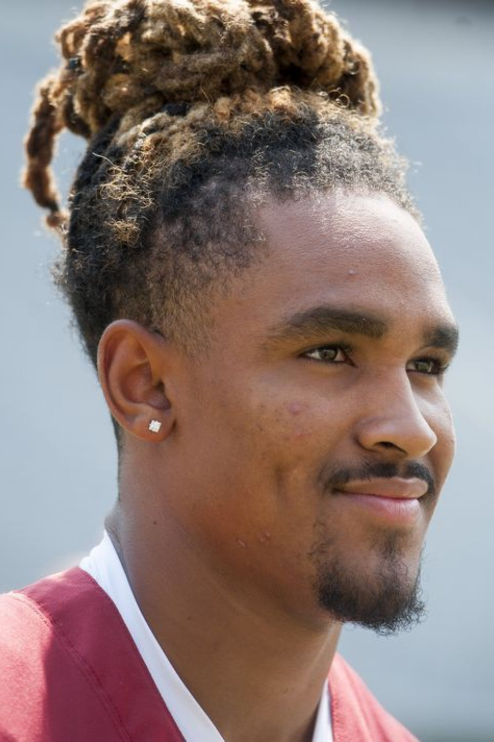 jalen hurts dreads tied up