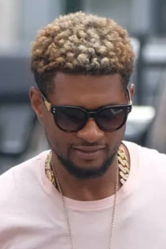usher with blonde hair and tips
